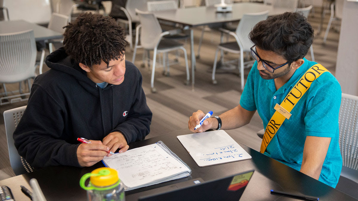 A Fulton Schools tutor works with a student in a Fulton Schools Tutoring Center.